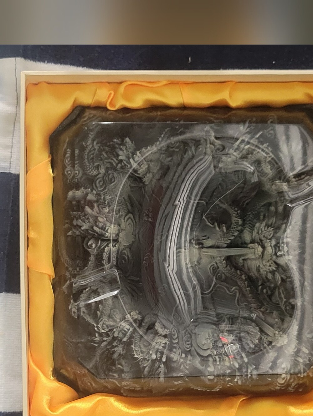 Decorative Black Glass Ashtray with Ornate Dragon Motif.